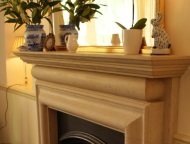 Hand-carved traditional stone fireplace