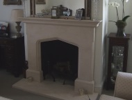 Traditional minimalist stone fireplace
